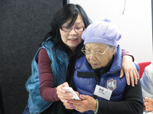 Case Manager Guiding Client on Using Smart Phone